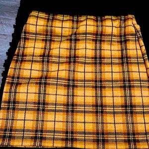 yellow and black plaid skirt.